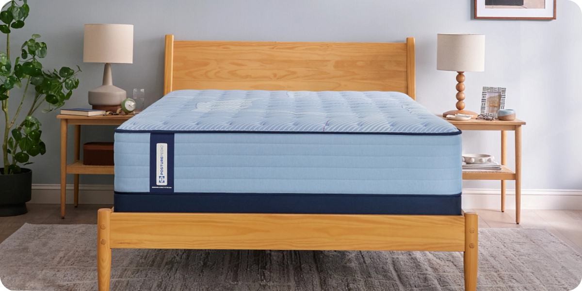 Sealy Posturepedic Spring mattress on a wooden bed frame